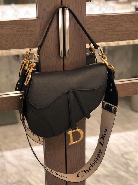 dior black.saddle bag|Dior saddle bag on model.